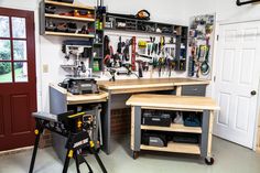 a workbench with tools on it in a garage