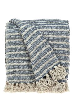 a blue and white striped blanket with fringes