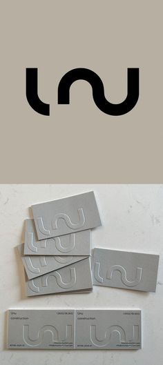 the letter u is made out of silver foil and has black letters on each side