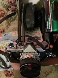 a camera sitting on top of a table next to other items