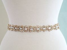 26" Jeweled part, Wedding Belt, Bridal Sash Belt - GOLD Clear Stone Champagne Stone  Vintage White Opal stone Wedding Sash Belt **JEWELED Applique size - approximately  26 1/4" long and 1" wide.   (widest point).  ** Self tie ribbon ties in the back. Total sash belt is measuring about 3.5 yards, 5/8" width wide.  ** Double face satin ribbon colors are available in White, Off White, Ivory, Black, Navy and Silver Grey, BLUSH    Please select the sash color from the drop-down menu **Due to all prod Gold Embellished Wedding Sash, Gold Embellished Sashes For Wedding, Bridal Sash Belt, Tie Ribbon, Wedding Belt, Wedding Sash Belt, Stone Wedding, Belt Gold, Wedding Sash