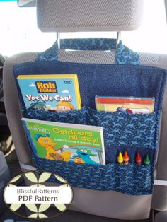 the back seat pocket is filled with books and crayons