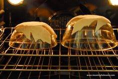 two pastries sitting on top of an oven rack