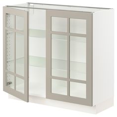 a white cabinet with glass doors and shelves on both sides, in front of a white background