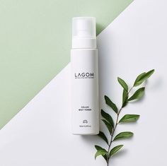 a bottle of lagom cleanser next to a plant