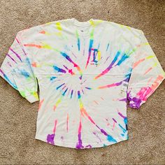 Limited Edition Disneyland Splatter Spirit Jersey With A Unique Neon Rainbow Tie Dye Design. Sold Out Online And Hard To Find Item. Size Small. 100% Cotton. Summer White Paint Splatter Tops, Tie Dye Disney Shirts For Family, Disney Tie Dye Shirts, Mickey Mouse Tie Dye, Tie Die Disney Shirt, Hand Dyed Tie-dye Crew Neck Sweatshirt, Disney Shorts, Mickey Mouse T Shirt, Disney World Christmas