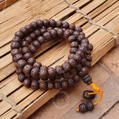 Discover the harmonious blend of spirituality and protection with our stunning Natural Antique 108 Dark Aged Rudraksha Mala Rosary. Handcrafted with love and care, this 108-bead rosary brings together the spiritual essence of Hindu and Buddhist traditions ❤Product Details:  Great Mala For Meditation and Yoga Practitioners  Well Strung on macrame cotton thread   Beads are approximately 8-9mm and Malas is around 32-34 Inches Long ❤ Natural Dark Rudraksha Beads: Each bead is carefully selected for its rich color and natural texture, providing a tactile and visual connection to the Earth's energy Beads are naturally stained and oiled to achieve their beautiful dark color and aged appearance.  ❤Spiritual Significance: The 108 beads in this rosary hold deep spiritual significance, traditionally 108 Spiritual Beads For Meditation, Spiritual Beaded Bracelets For Rituals, 108 Spiritual Meditation Beads, Round Beaded Bracelets For Meditation And Festivals, Holistic Beaded Bracelets With Round Beads For Meditation, Beaded Bracelets With Round Beads For Meditation And Festivals, 8mm Spiritual Beads For Meditation, Meditation Bracelets With 8mm Beads, Spiritual Beaded Bracelets