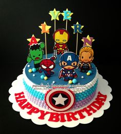 the birthday cake is decorated with cartoon characters