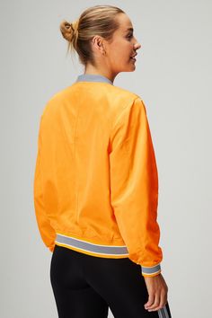 Satin Bomber Jacket Fabletics orange female Activewear >> Womens >> Jackets & Outerwear >> Jackets regular Everyday Bomber jacket in Satin Stretch fabric. Orange Outerwear For Sports In Fall, Orange Sporty Windbreaker For Sports, Sporty Orange Windbreaker, Orange Sporty Windbreaker, Gym Outerwear With Ribbed Cuffs, Orange Long Sleeve Sporty Windbreaker, Long Sleeve Orange Track Jacket For Fall, Orange Long Sleeve Track Jacket For Fall, Orange Sporty Windbreaker For Fall