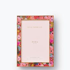 a pink and gold floral frame with the words relief paper co in front of it