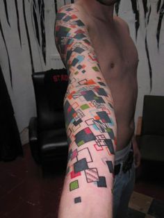 a man with a colorful tattoo on his arm