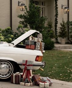 a white car with presents in the trunk