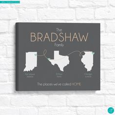 the bradshaw family is hanging on a brick wall with their name and location