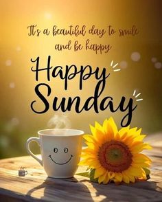 a cup of coffee and a sunflower on a wooden table with the words happy sunday