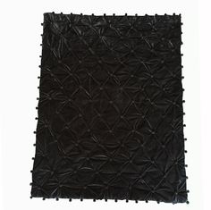 a black area rug on a white background