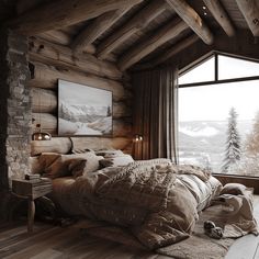 a large bed in a bedroom next to a window with a mountain scene on the wall