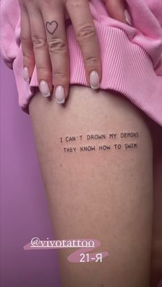 a woman's legs with a tattoo saying i can't drown my demons they know how to smile