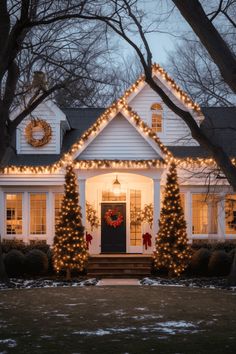 a white house with christmas lights on it