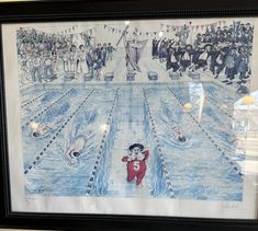 a drawing of an olympic swimming pool with swimmers and spectators in the background, framed by a black frame