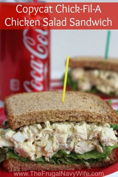 a chicken salad sandwich is on a red plate with a soda in the background and text overlay reads copycat chick - fila chicken salad sandwich