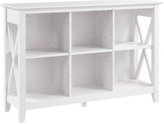 a white bookcase with four shelves on one side and two open doors at the top