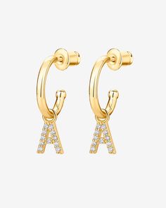 Make it personal. Make it yours. The PAVOI 14K gold-plated huggie earrings with initial dangles and 925 sterling silver posts add the perfect personal touch to any outfit (and make the most thoughtful gift). Adorned with sparkling cubic zirconia initials, these huggie hoop earrings take you from day to night with ease. AAAAA Cubic ZirconiaMeasurements: Diameter: 12mm (.45"); Thickness: 1.5mm (.06").Dangle: 6 x 3.6 mm White Huggie Earrings With Pave Setting, Sterling Silver Initials Earrings, 14k Yellow Gold Earrings With Initials, Timeless Pave-set Huggie Hoop Earrings, Letter Earrings Initials, Huggie Earrings, Huggie Hoop Earrings, Huggies Earrings, Personal Touch