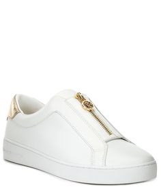 From Michael Kors&#x2C; the Keaton Leather Zip Sneakers feature:Vachetta leather upper with metallic synthetic trimSlip on with MK pull front zipper closureTextile liningRubber outsoleFlat heelImported. Leather Sneakers With Zipper Closure, Leather Sneakers With Zipper Closure For Spring, Mk Shoes, Michael Kors Sneakers, Black And White Pillows, White Pillows, Dillard's, Leather Sneakers, Casual Sneakers