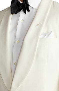 Classic in color, cut and composition, this cream-hued dinner jacket sets a polished course, tailored with a shawl collar and welt pockets from wool barathea. 30" length (size 40R) One-button closure Shawl collar Nonfunctional four-button cuffs Chest welt pocket; front welt pockets Side vents Cupro lining 100% wool Dry clean Made in Italy Men's Designer Clothing Elegant Beige Outerwear With Suit Collar, Wedding Blazer With Lapel Collar, Luxury Cream Blazer With Notch Lapel, Wedding Outerwear With Lapel Collar And Single Button, Semi-formal Cream Outerwear With Suit Collar, Elegant Cream Outerwear With Shawl Collar, Elegant Cream Shawl Collar Outerwear, Cream Wool Blazer For Business, Luxury Cream Blazer With Lapel Collar