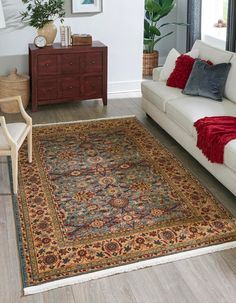 a living room filled with furniture and a rug