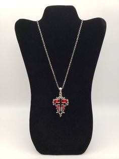 Red heart with black cross necklace. Gothic Red Necklace With Chain, Red Emo Necklace For Gift, Red Gothic Chain Necklace, Gothic Red Chain Necklace, Silver Cross Necklace For Halloween, Halloween Gift Necklace With Cross Pendant, Halloween Gift Cross Pendant Necklace, Gothic Heart Pendant Necklace For Halloween, Red Cross Necklace For Valentine's Day