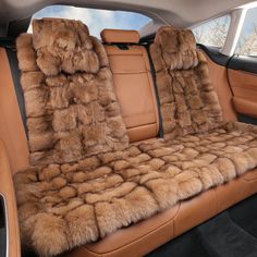 the interior of a car with two seats covered in fur