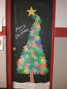 a door decorated with handprints and a christmas tree