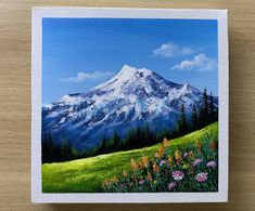 a painting of a mountain with wildflowers in the foreground