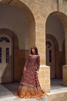 Pakistani Bridal Dress in Farshi Lehenga Kameez Style is a heavily embellished attire adorned with Goldwork and Floral designs. Dabka, Threads, Tilla, and embroidery make this stunning Lehenga Dress an epitome of beauty and your foremost priority for the wedding. Lehenga Kameez: The stunning kameez in an alluring red color is beautifully embellished with the intricate zardosi and shimmering silver gold work. Dabka, embroidery, threads, sequins, and motifs make this red kameez a perfect choice to wear on the big day. Intricate design on the kameez give it a flawless finishing look. Bridal Lehenga: The embellished kameez is paired with Bridal Lehenga, creating a lavish Pakistani Bridal Outfit. The Farshi Lehenga has an alluring contrast of red and orange shade and is gracefully emblazoned wi Farshi Lehenga, Bridal Outfits Pakistani, Lehenga Kameez, Trending Bridal Lehenga, Kameez Style, Dabka Embroidery, Bridal Lehenga Pakistani, Nameera By Farooq, Bridal Dresses Pakistani