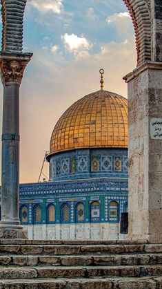 the dome of the rock in the middle of an outdoor area with steps leading up to it