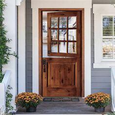 a wooden door on the side of a house