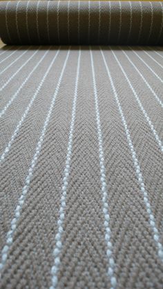 a close up view of a carpet with lines on it