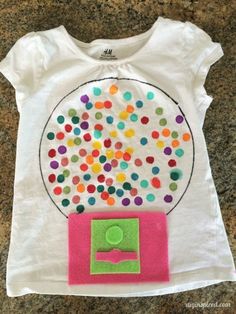 a t - shirt that has been made to look like a gumball machine with sprinkles on it