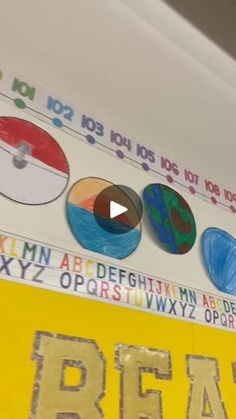 a classroom wall decorated with magnets and letters