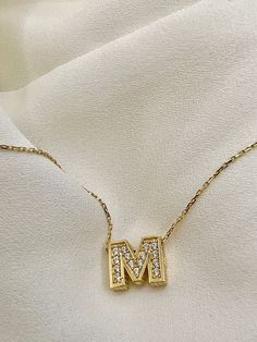 "Precious looking initial letter M  necklace* elegant, simple and meaningful! hand-crafted with love . - 14K SOLID GOLD+ CUBIC ZIRCONIA  - WEIGHT: 2.11 gr - Necklace LENGTH: 16 1/2\" - PENDANT LENGTH: 3/8\" Each item comes with a beautiful box and a message card. Thank you very much for visiting my shop:) HOW TO CARE FOR YOUR JEWELRY: + Unlike any gold-filled, plated, or vermeil jewelry that is not solid gold, wet areas, perfumes, and lotions will not damage your jewelry. You can use your specia Gifts Fir Mom, Letter M Necklace, M Alphabet, Gold Necklace For Men, Real Gold Chains, Alphabet Pendant, M Necklace, Gold Letter Necklace, Best Gifts For Him