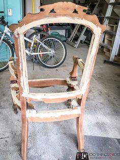 an old chair is being worked on in a garage