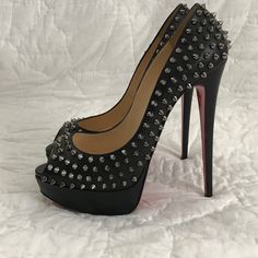 This Black Spiked Christian Louboutin Stiletto Shoes. Used. Limited Edition. Black Spiked Evening Heels, Black Spiked Heels For Evening, Designer High Heel Shoes With Studs, Designer Studded Open Toe Heels, Designer Studded High Heels, Designer Open Toe Heels With Studs, Luxury Spiked Heels For Party, Designer High Heels With Studs, Designer Spiked High Heels