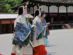 A man and two women dressed in heian robes. Things To Come