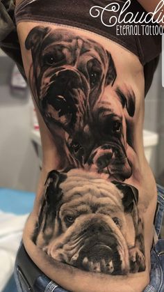 a woman's stomach with an image of two dogs on the side and one is showing