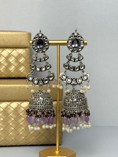 Silver and purple long Jhumkas ------------------------------------------------------------------------------ ♡ SPECIAL PRICING ♡   Buy 2 or more items and get free delivery anywhere in Canada. Free US delivery for orders over $35 USD ♡ WEBSITE ♡  Shop directly on our website for more deals  www.TheJewelBlitz.com  ------------------------------------------------------------------------------ ♡ SHIPPING ♡   All of our orders come with tracking and are usually shipped next day.  Canada: 2-8 busine Bohemian Purple Earrings For Wedding, Traditional Purple Dangle Earrings, Silver Chandbalis With Mirror Work, Festive Purple Kundan Earrings, Traditional Kundan Purple Earrings, Traditional Purple Kundan Earrings, Silver Earrings With Mirror Work For Diwali, Silver Kundan Jhumkas With Mirror Work, Silver Danglers With Mirror Work For Diwali