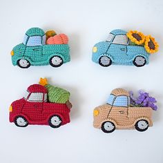 four crocheted cars with sunflowers in the back and one on top