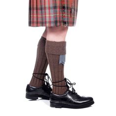 "- Brown color - Sizes small, medium, & large - Wool, acrylic, and nylon blend - Woven in the UK - Fits up to an 18 inch calf The quality wool blend kilt hose will help you look your best with dressy-casual or formal wear, kilt hose and flashes are essential. For casual wear, you can wear sandals, boots, or whatever you want to with your kilt. These hose feature a diamond cuff with a ribbed leg.  Made of a high-quality 40% wool, 40% acrylic, and 20% nylon  blend, and woven in the UK. Fits up to approximately an 18″ calf. choose from colors off-white, black, navy blue bottle green, lovat blue, lovat green, charcoal, burgundy, and weathered brown. Search, \"AKH01\" in our shop for more kilt hose colors." Fitted Brown Mid-calf Socks, Fitted Brown Winter Socks, Brown Winter Socks, Brown Knee-high Socks For Winter, Uk Fits, Kilt Socks, Thistle Pattern, Dress Hire, Tartan Kilt