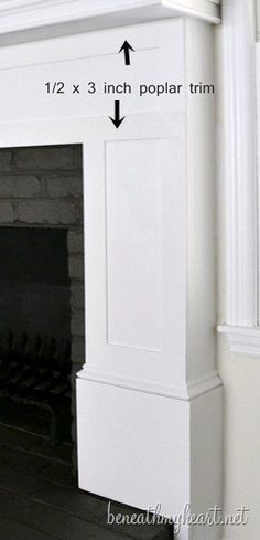 the fireplace is white and has an arrow pointing up to it's top shelf