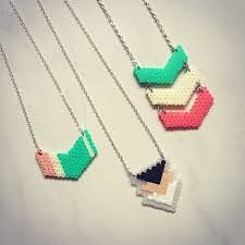 three necklaces with different colors and designs on them