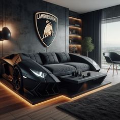 a living room filled with black furniture next to a large wall mounted lamb logo on the wall